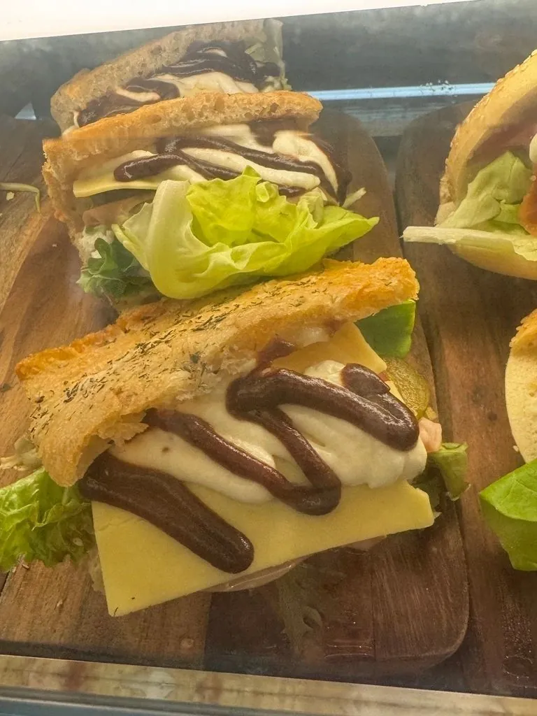 Stacked cheese and salad sandwich in the café cabinet